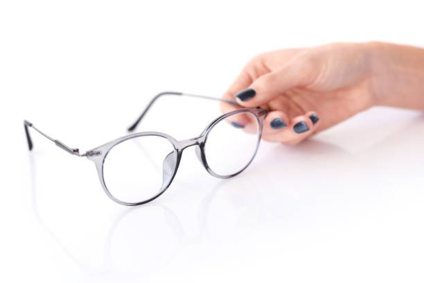 istock Beautiful glasses whit female hand on white background 1083608886