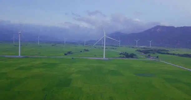 High-quality stock video footage wind turbine in a green field - Energy Production with clean and Renewable Energy. Phan Rang, Vietnam
