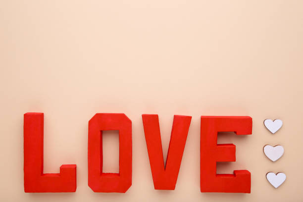 istock Red letters love on beige background. LOVE word. 1083611932