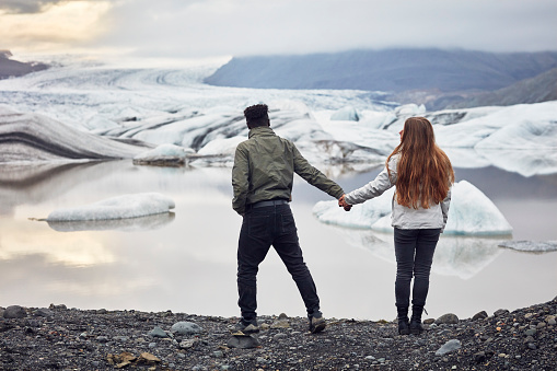 Couple having fun and hugging. Glacier lagoon