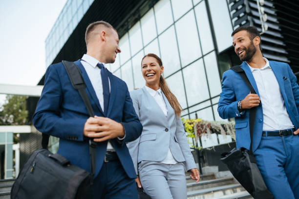 istock Three business colleagues having discussion while walking outdoors 1083614250