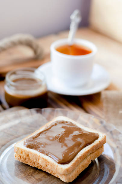 istock Toast with peanut butter and a cup of tea. 1083614448