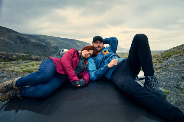 istock Couple enjoying glacier lagoon from car mask 1083617412