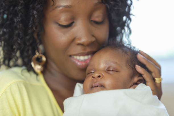 istock Newborn baby at home with mom 1083618644