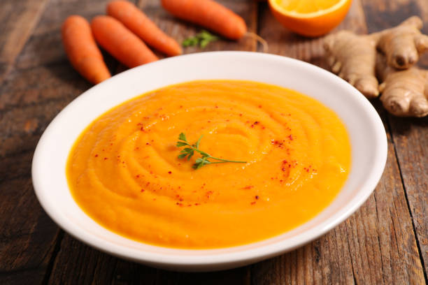 istock carrot and orange soup 1083619112