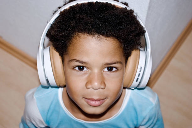 istock Little Boy Enjoying His Music 1083624760
