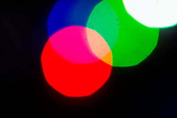 istock Colorful bokeh with big circles on black background. 1083625158