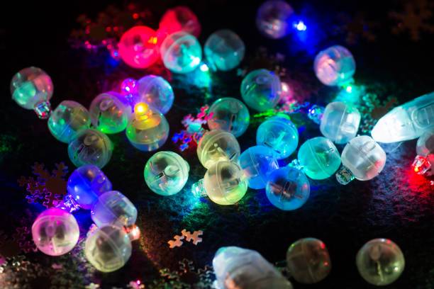 istock Many tiny colorful shining decorative led bulbs on black. 1083625172