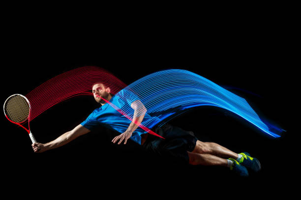 istock one caucasian man playing tennis player on black background 1083627656