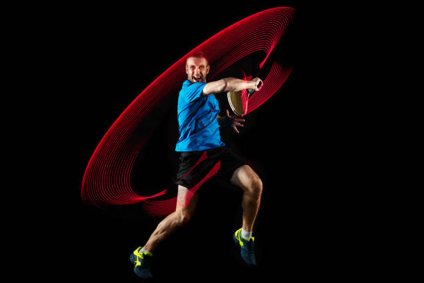 istock one caucasian man playing tennis player on black background 1083627664