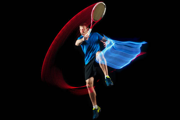 istock one caucasian man playing tennis player on black background 1083627670