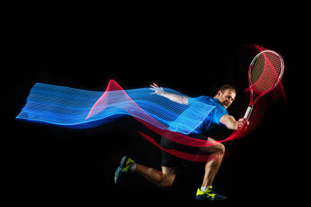 istock one caucasian man playing tennis player on black background 1083627682