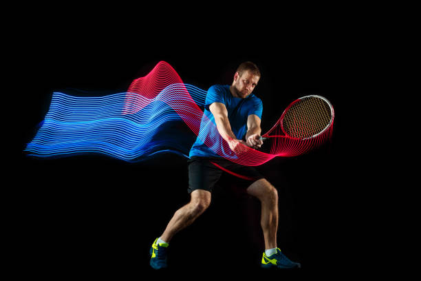 istock one caucasian man playing tennis player on black background 1083627704