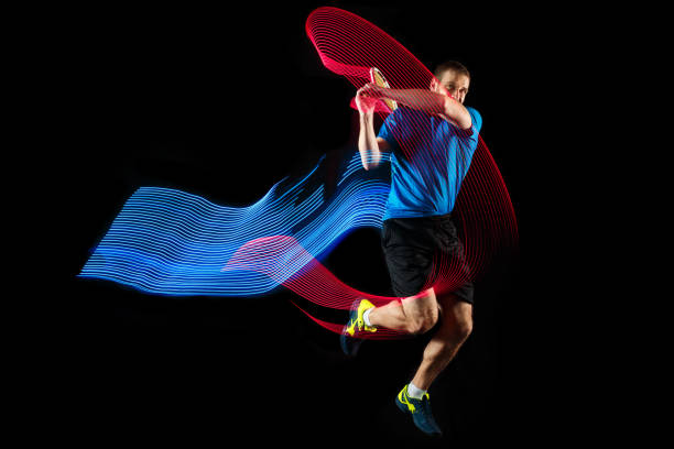 istock one caucasian man playing tennis player on black background 1083627706