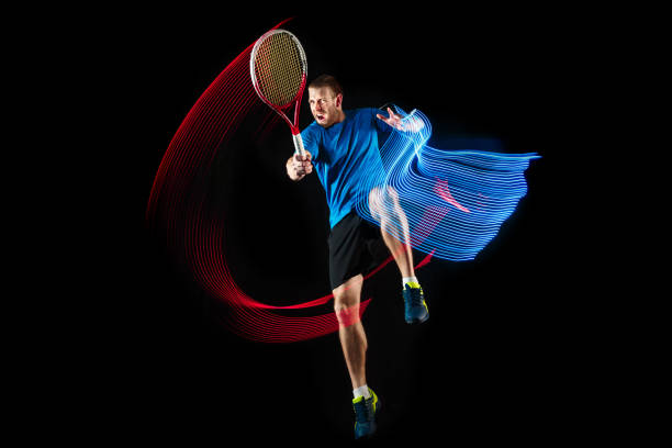 istock one caucasian man playing tennis player on black background 1083627730