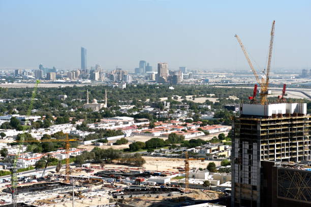 istock Aerial view of under construction building with cranes from downtown, visible whole Zabeel district, Dubai Creek harbor, Dubai Canal to Business Bay and Al Khail road 1083629608