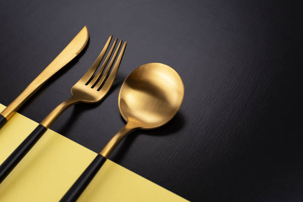 istock Set of black and gold cutlery 1083630362