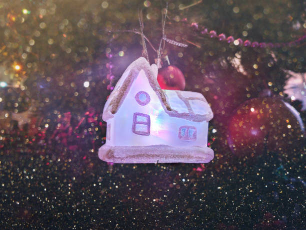 istock decorative house standing in the Christmas tree 1083630388