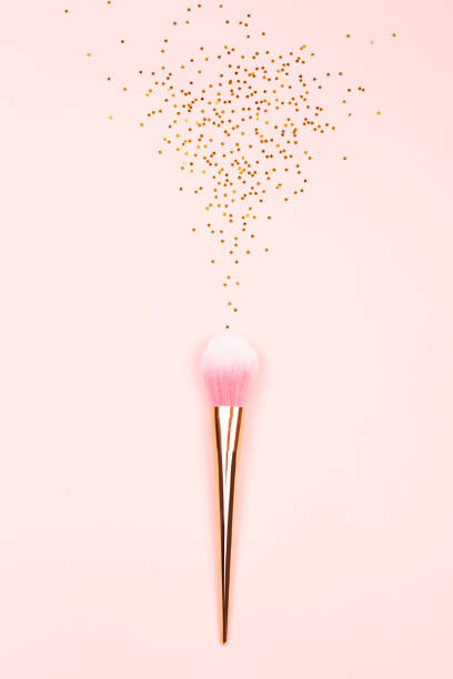 istock Pink makeup brush and confetti 1083630482