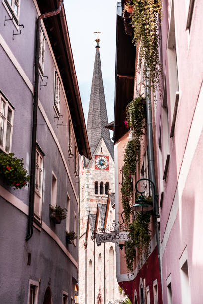 istock Hallstatt evangelic church framed between old houses. 1083632386