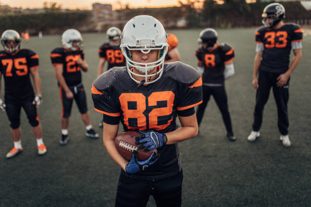 istock Football players on practice 1083632458