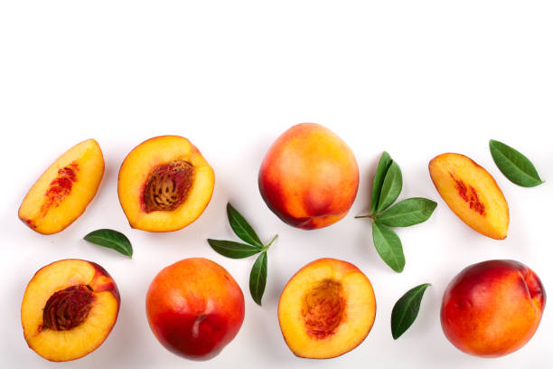 istock ripe nectarine with leaves isolated on white background with copy space for your text. Top view. Flat lay pattern 1083638128