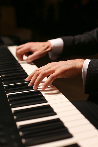 Close-up of a woman playing synthesizer