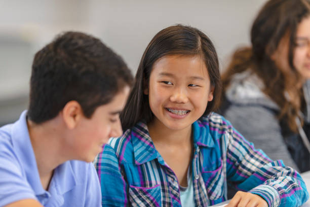 istock Teenagers talking in school 1083641596