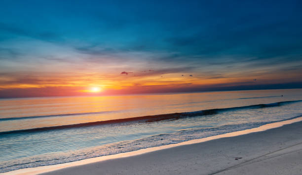 istock Sunset and the sea in orange dark sky. 1083641852
