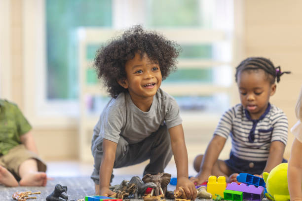 istock Smiling toddler boy in daycare 1083642558