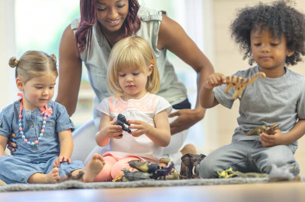 istock Preschool teacher with toddlers 1083642562