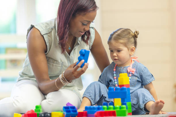 istock Preschooler and teacher 1083642570