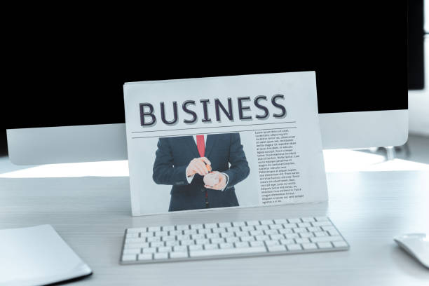 istock business newspaper and computer on table in office 1083649224