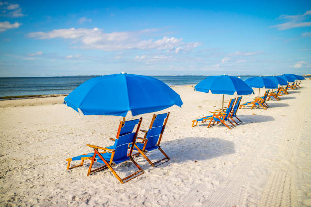 A beach Chaise Longue fronting the beach in Fort Myers, Florida A relaxing way to view and hear the sound of the waves in Bowditch Point Park fort myers beach photos stock pictures, royalty-free photos & images