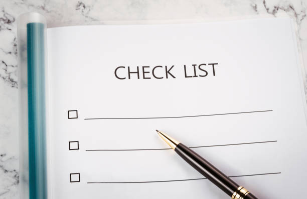 istock check list and pen on desk. 1083649458