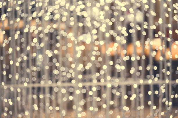 istock Christmas light background. Holiday glowing backdrop. Defocused Background With Blinking Stars. Blurred Bokeh. 1083649754