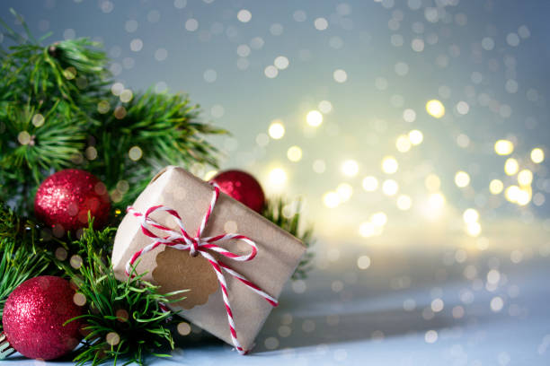 istock Secret Santa christmas game. Gift exchange. Wrapped gift box with notes on blue pastel background 1083650354