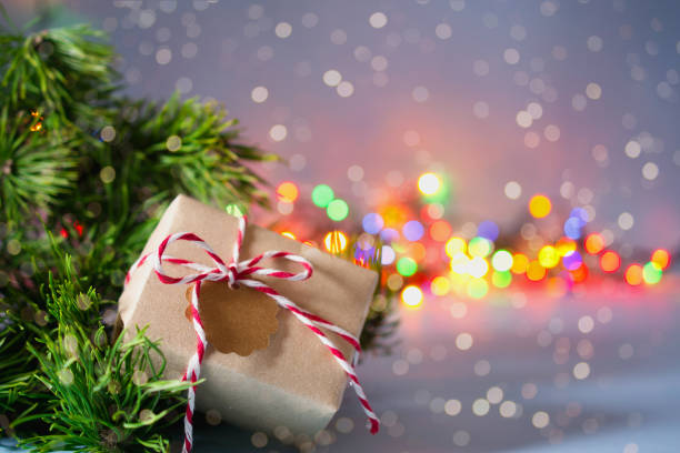 istock Secret Santa christmas game. Gift exchange. Wrapped gift box with notes on blue pastel background 1083650356