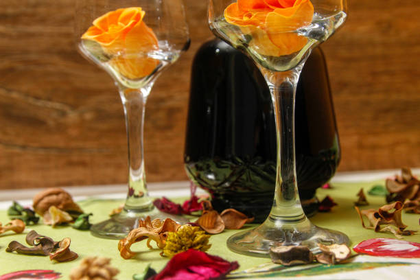 istock Romantic composition with wine glass, roses and bottle of wine 1083651712