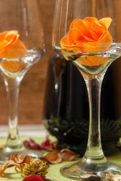 istock Romantic composition with wine glass, roses and bottle of wine 1083651722