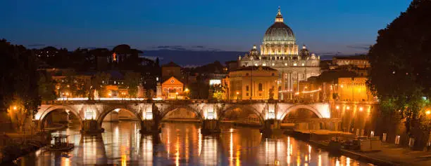 Photo of Rome illuminated dusk over River Tiber St Peters Vatican Italy