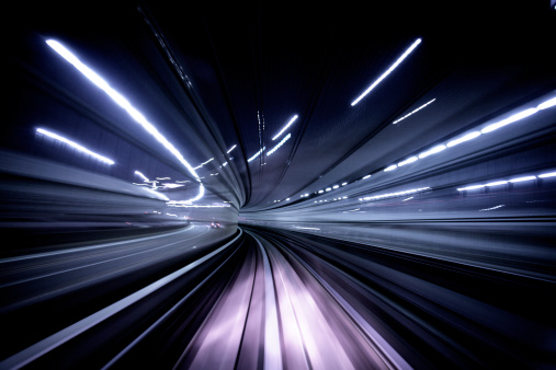 Night blur traveling through a tunnel. Tokyo, Japan