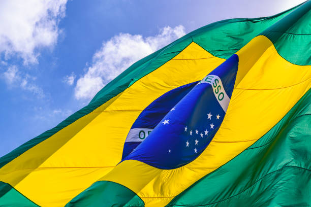 istock Brazilian Flag Waving Over Sky 1083653924