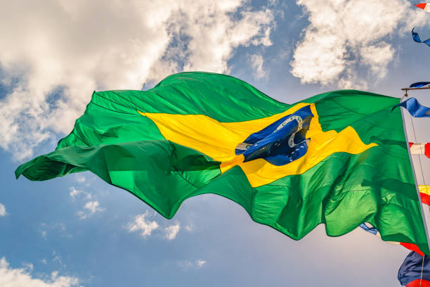 istock Brazilian Flag Waving Over Sky 1083653940