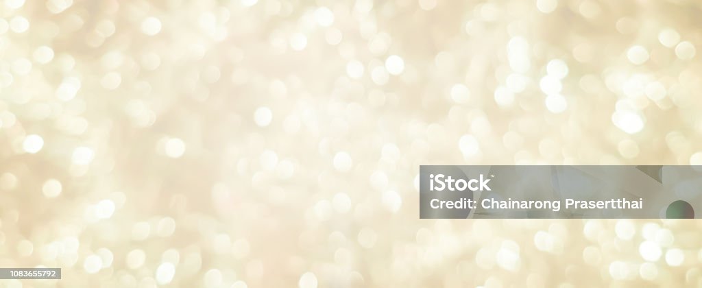 abstract blurred soft bright cream color panoramic background with glowing light and bokeh light effect for merry christmas and happy new year 2019 festival design and element  concept Backgrounds Stock Photo