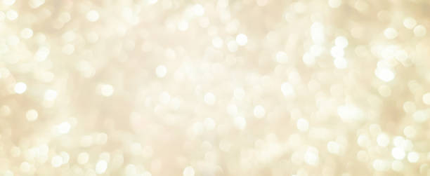 abstract blurred soft bright cream color panoramic background with glowing light and bokeh light effect for merry christmas and happy new year 2019 festival design and element  concept abstract blurred soft bright cream color panoramic background with glowing light and bokeh light effect for merry christmas and happy new year 2019 festival design and element  concept bronze colored photos stock pictures, royalty-free photos & images