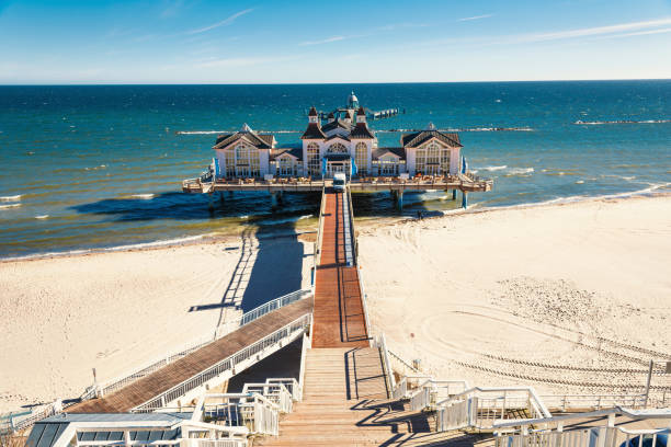 Seabridge in Sellin - Island Rugen, Baltic Sea Germany Seabridge in Sellin - island Rugen - with Restaurant, Tourists, People on Holidays, eating and drinking outdoor and indoor mecklenburg vorpommern photos stock pictures, royalty-free photos & images