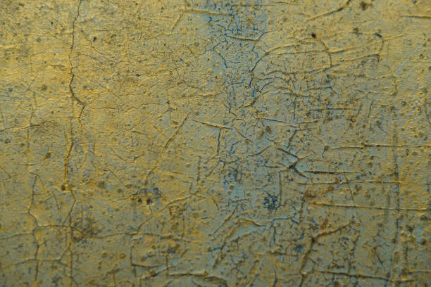 istock Abstract Grunge Pattina effect Pastel Gold Retro Texture.  Decorative wall paint. Blue and golden messy wall stucco texture background 1083661052