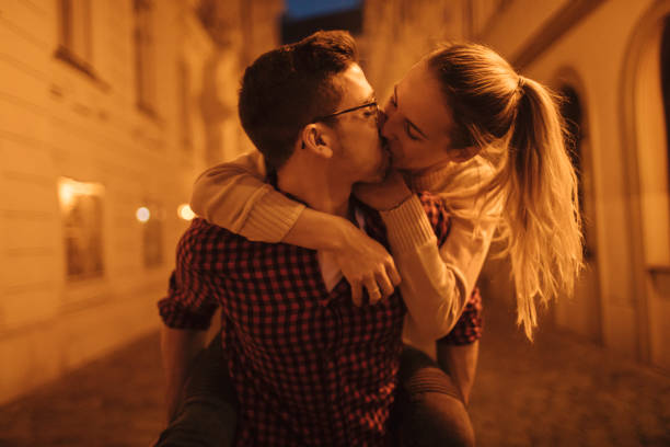 istock Girlfriend kissing her boyfriend 1083666450