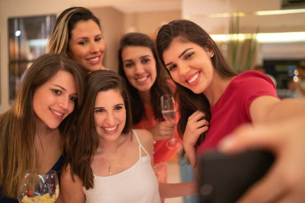 istock Girlfriends taking a selfie on Christmas Time 1083666790